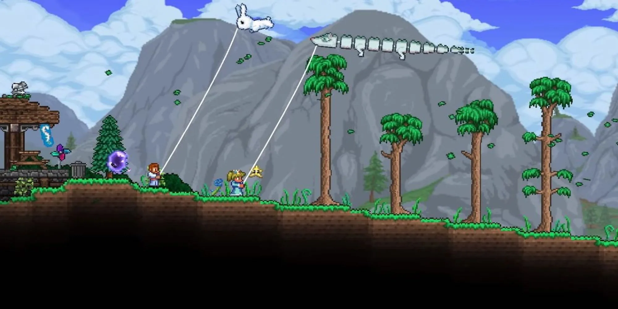 Hai người chơi Terraria đang thả diều trên một ngọn đồi
