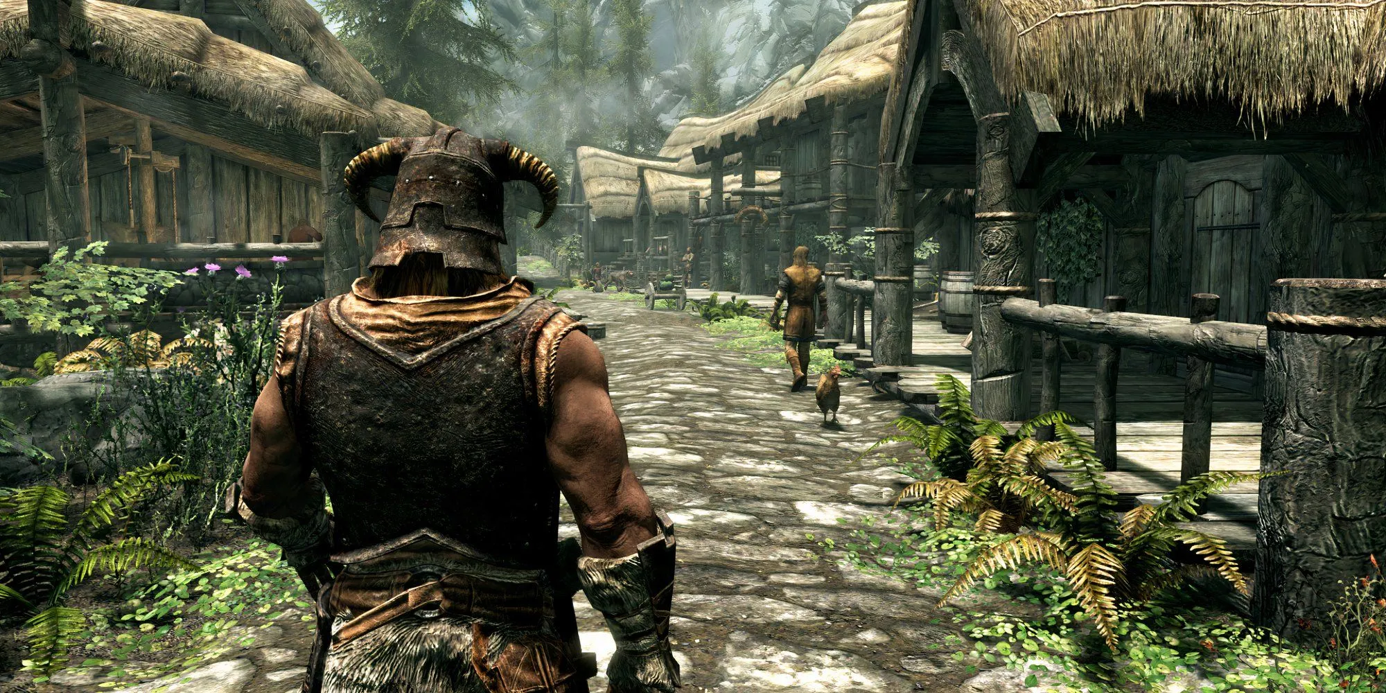 nhân vật chính Dragonborn trong The Elder Scrolls V Skyrim nhìn ra một ngôi làng từ phía sau lưng