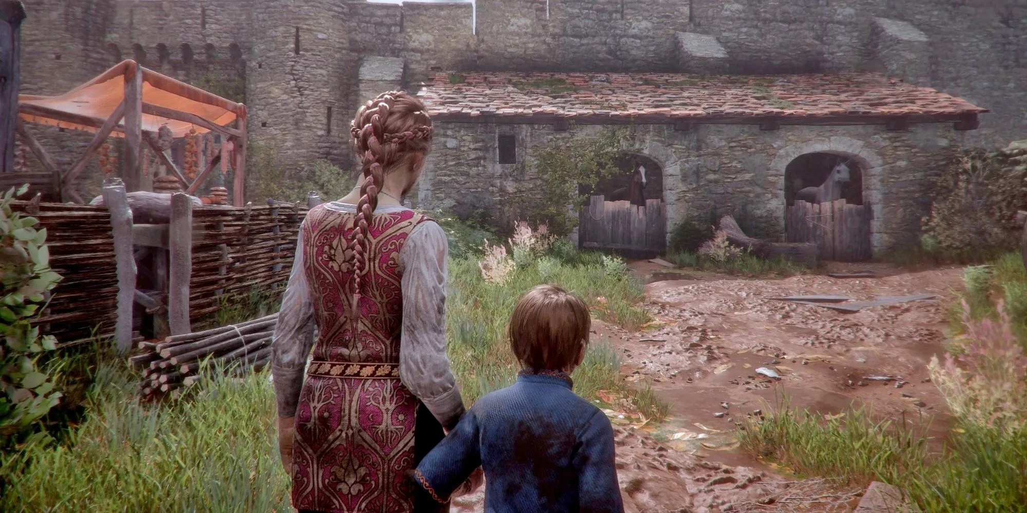 Amicia and Hugo holding hands while trying to reach a stable