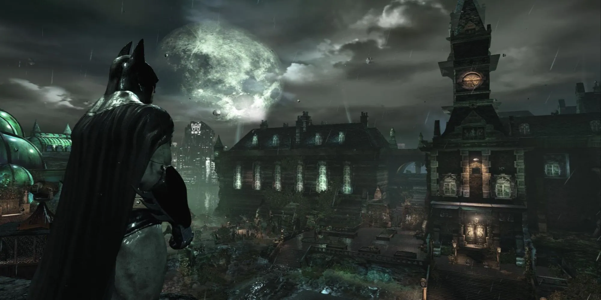 Batman đang đứng trong một hành lang của Arkham Asylum