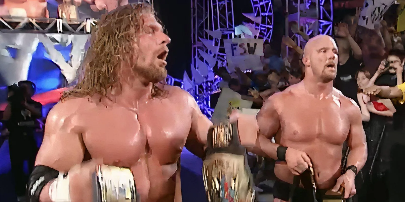 Bộ đôi The Two-Man Power Trip gồm Triple H và Stone Cold Steve Austin ăn mừng chiến thắng danh hiệu Đồng đội WWF.