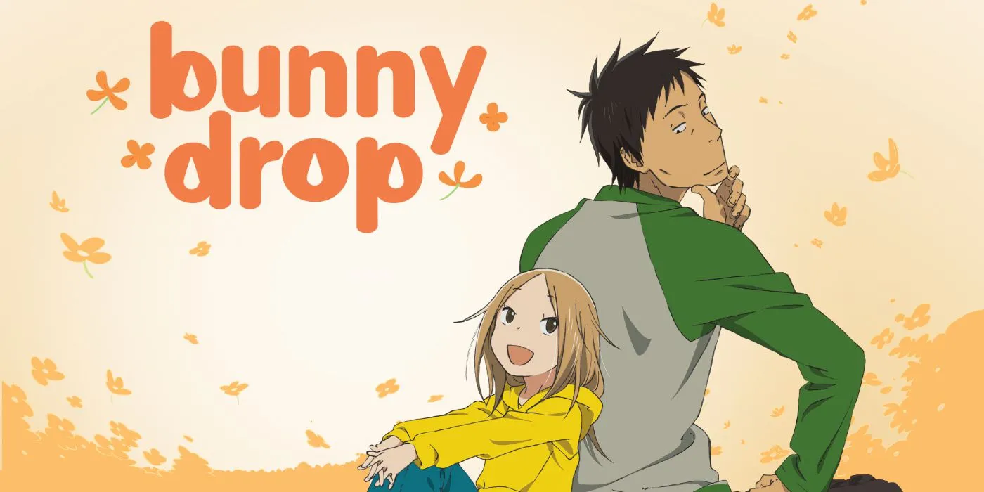 Daikichi Kawachi, nhân vật chính của Bunny Drop, bế cô bé Rin trong vòng tay, thể hiện tình cảm gia đình mới