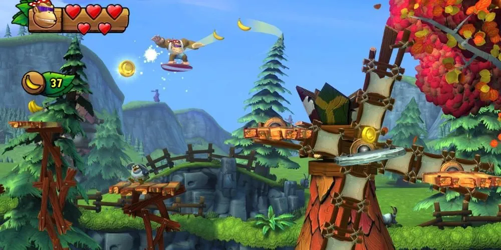 Funky Kong lướt ván bay qua không trung gần cối xay gió trong Donkey Kong Country Tropical Freeze