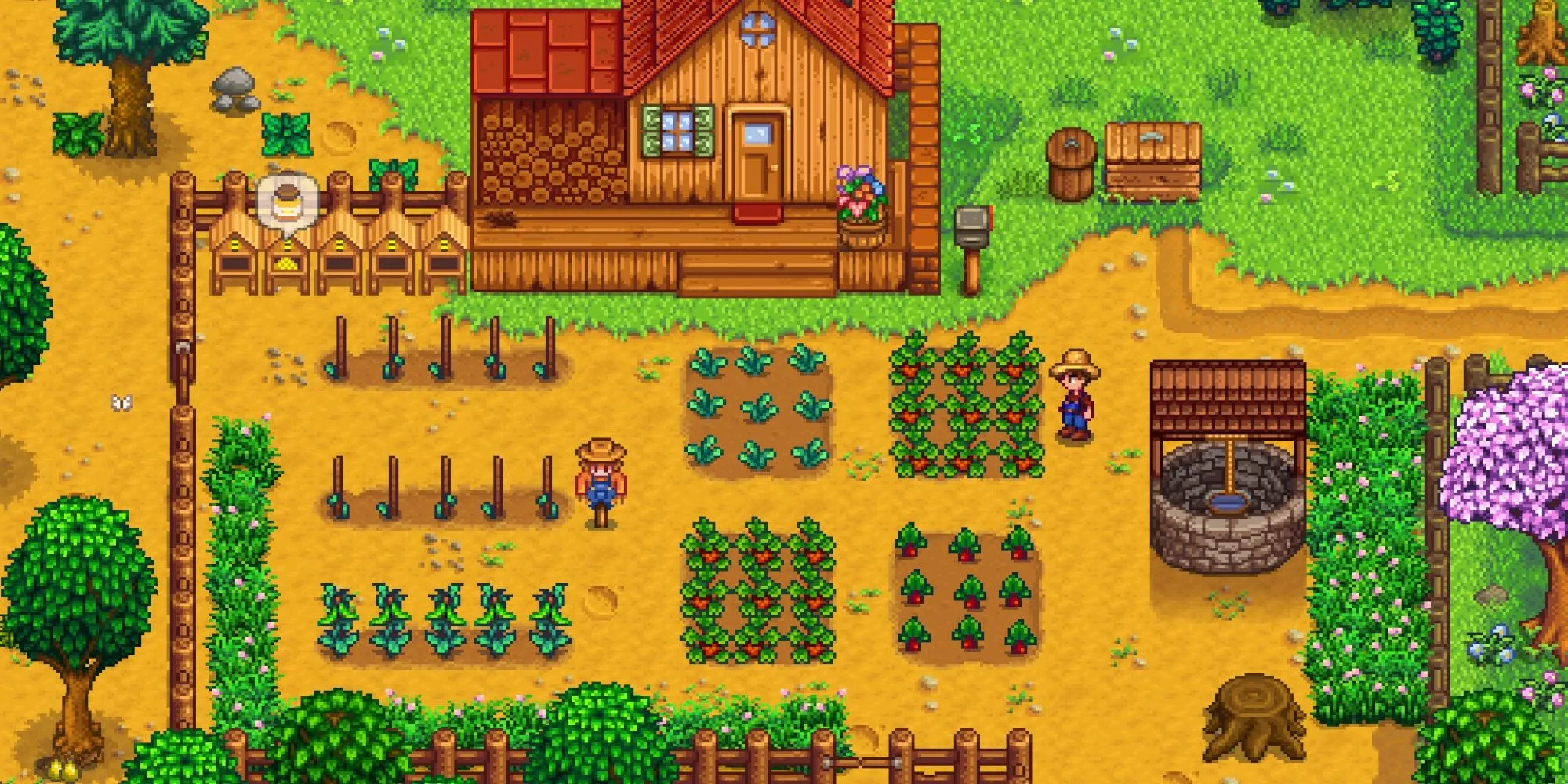 Góc nhìn từ trên xuống một trang trại tươi tốt với các nhân vật đang làm việc trong Stardew Valley.