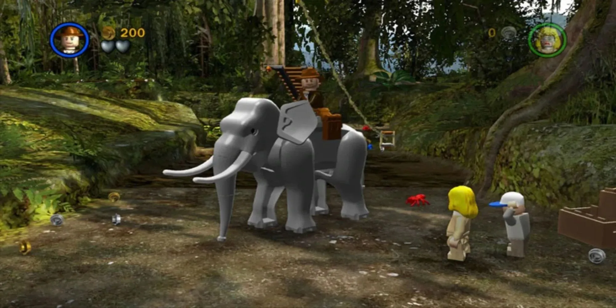 Hai nhân vật Lego Indiana Jones và Short Round trong một cảnh game hành động phiêu lưu Lego Indiana Jones: The Original Adventures trên PS2