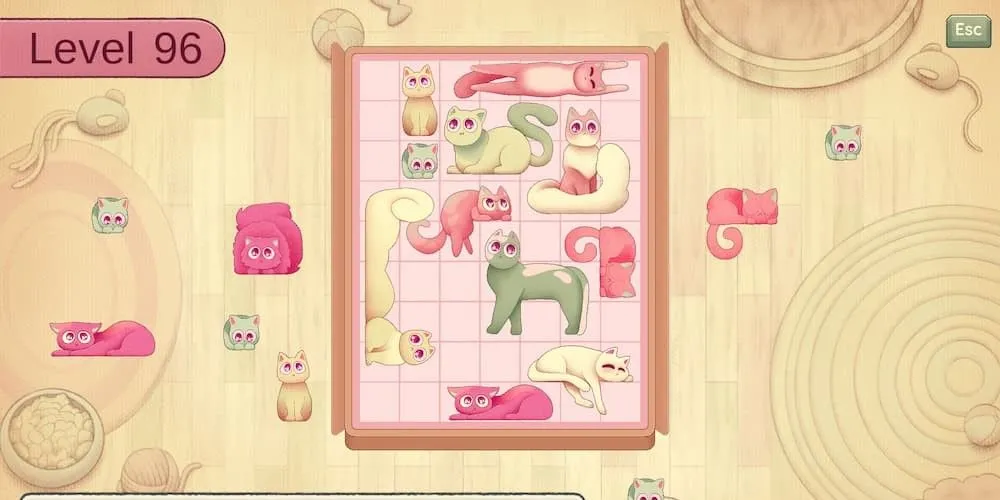 Hình ảnh những chú mèo có hình dáng khác nhau đang được xếp vào một chiếc hộp trong game Fit My Cat, thể hiện cơ chế giải đố xếp hình độc đáo.