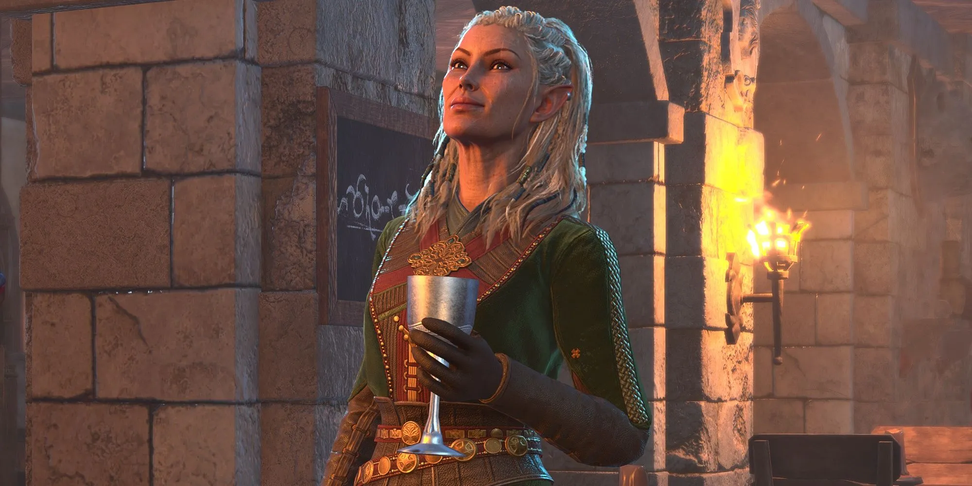Jaheira nâng cốc chúc mừng trong Baldur's Gate 3, thể hiện cá tính mạnh mẽ.