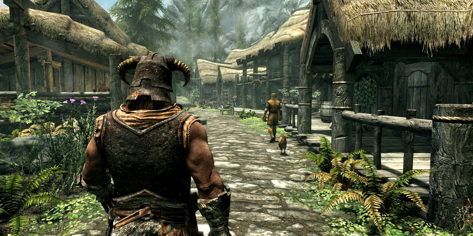 Nhân vật chính đi qua ngôi làng Riverwood thanh bình trong The Elder Scrolls V: Skyrim