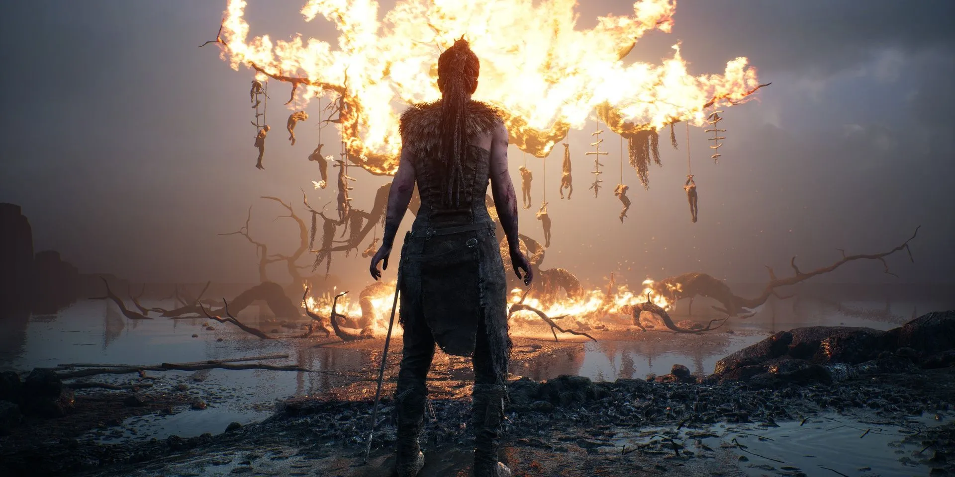 Nữ nhân vật Senua trong Hellblade Senua s Sacrifice đối mặt với bóng tối