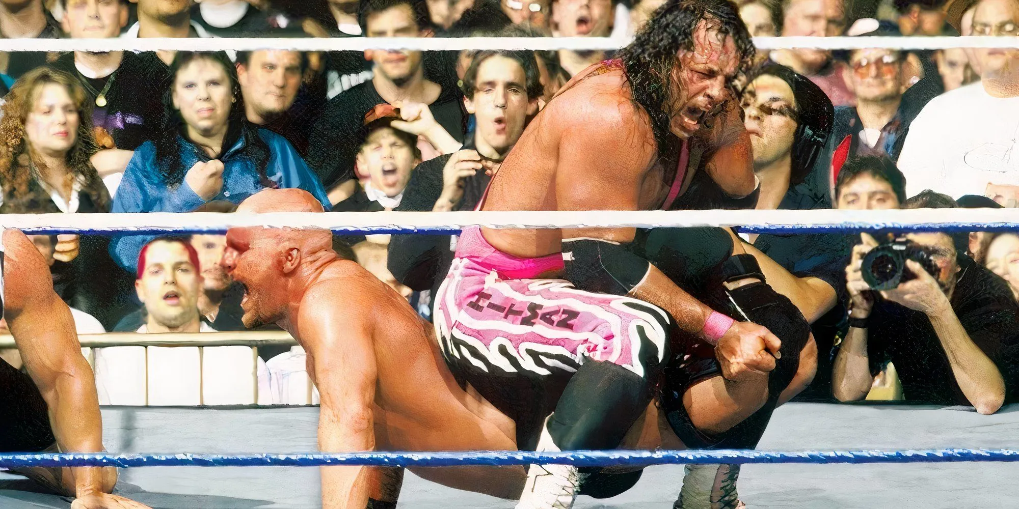 Stone Cold Steve Austin kiên cường không chịu tap trước Bret Hart tại WrestleMania 13, khoảnh khắc double turn lịch sử.