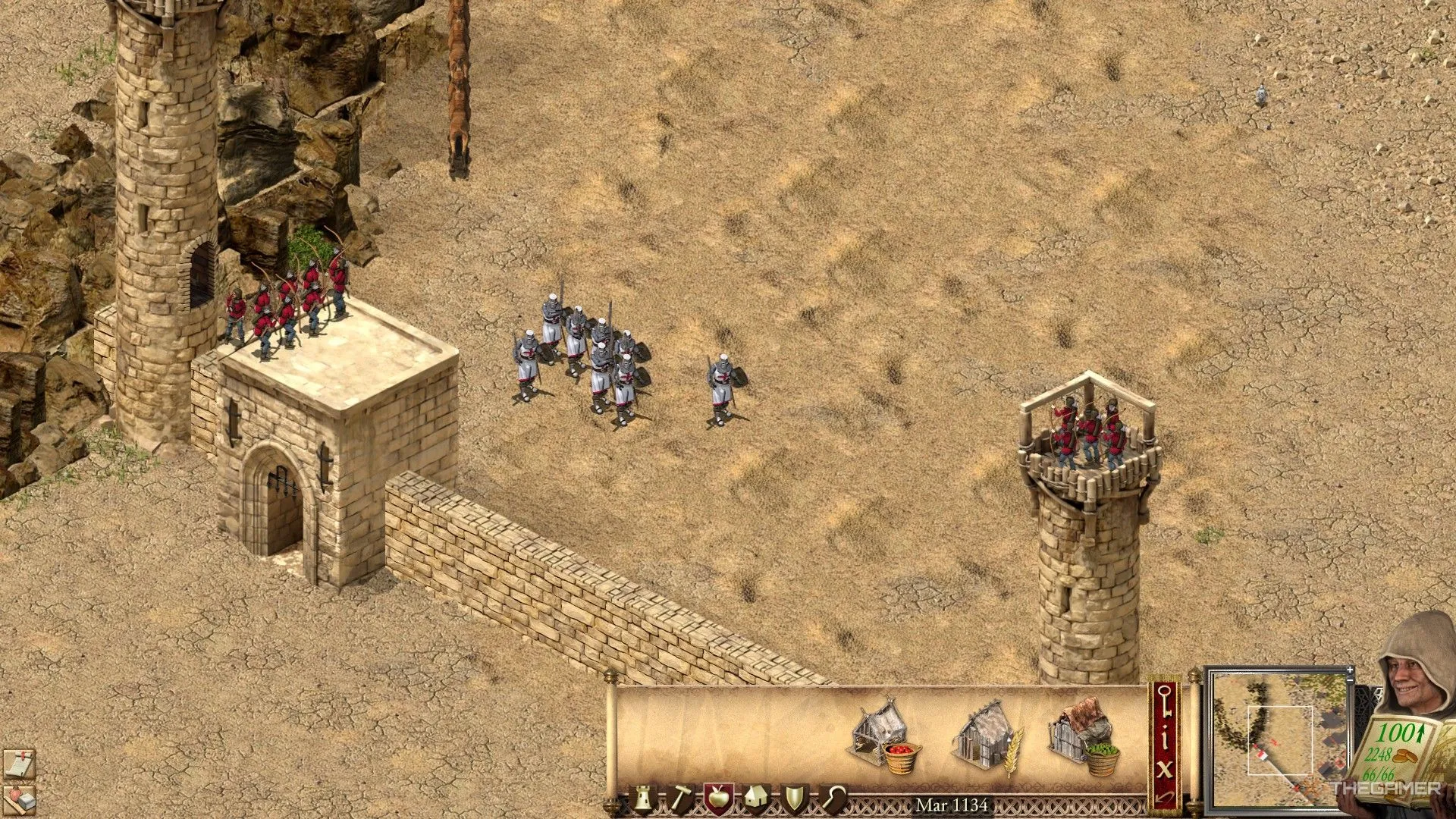 Kiếm sĩ và cung thủ phòng thủ cổng thành trong Stronghold Crusader Definitive Edition.