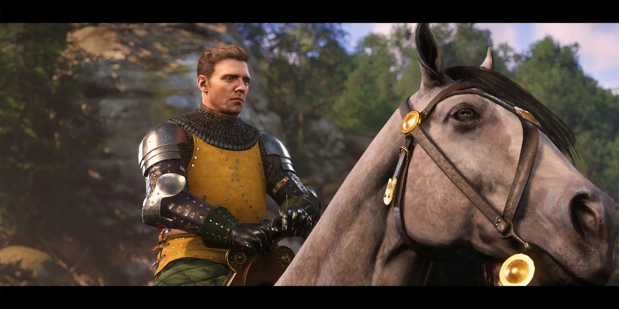 Henry cưỡi ngựa Pebbles cùng đồng đội trong Kingdom Come Deliverance 2