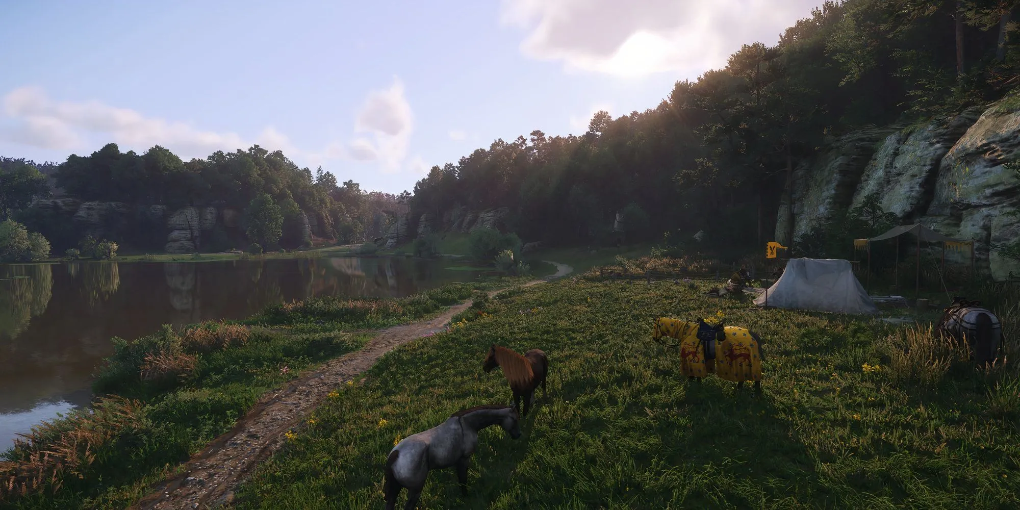 Henry và đoàn người cắm trại trong bối cảnh ban đầu của Kingdom Come Deliverance 2